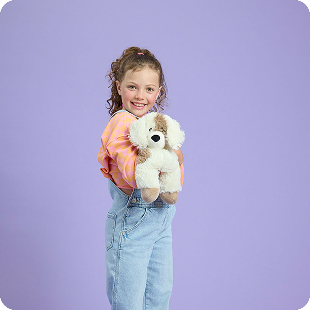 Image 104: girl holding puppy stuffed animal warmies