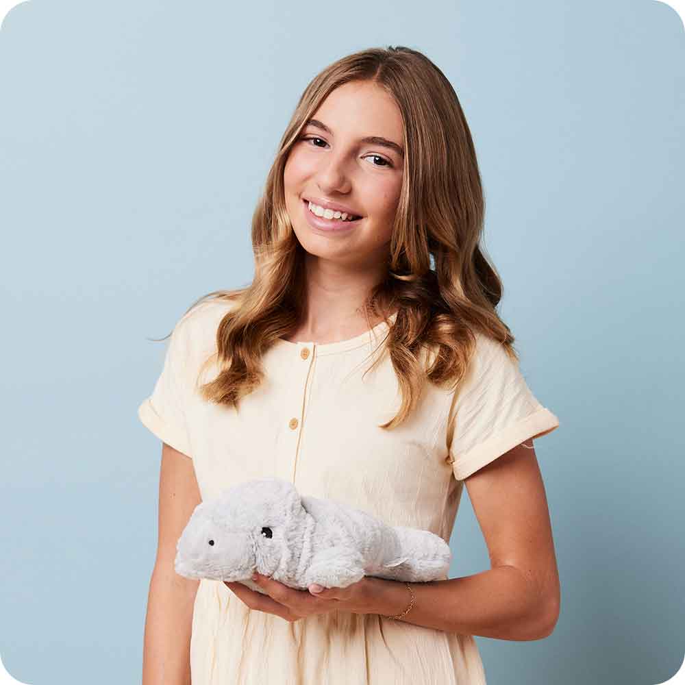 Image 101: Teen holding Soft Warm Weighted Manatee Plush Warmies