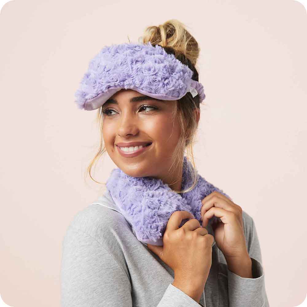 Image 91: Adult smiling with Lavender Scented Microwavable Curly Purple Warmies Neck Wrap