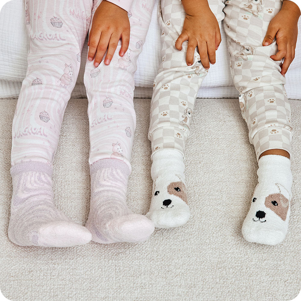 Image 104: two kids wearing warmies unicorn and puppy socks