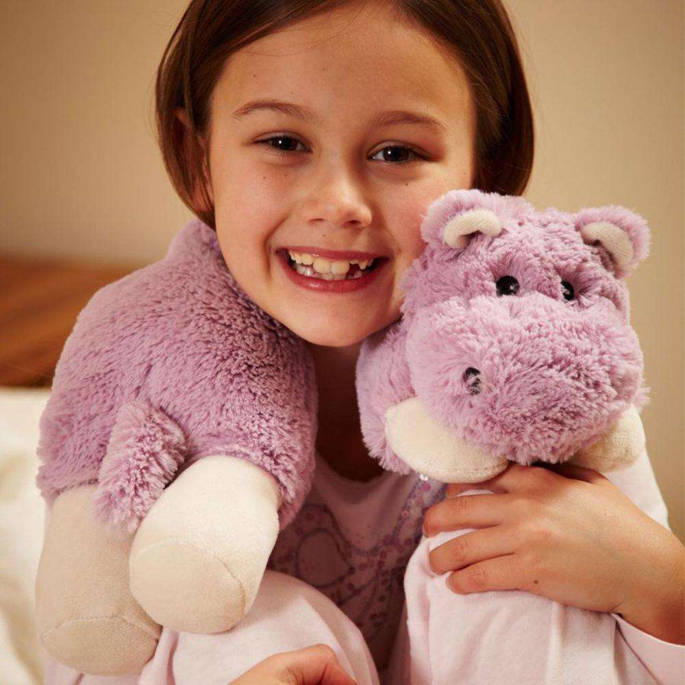 Image 95: Child smiling while wearing Soft Cozy Hippo Wrap Stuffed Animal Warmies