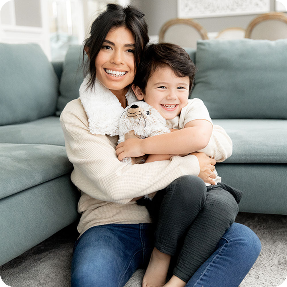 Image 99: mother and son cuddling seal stuffed animal warmies